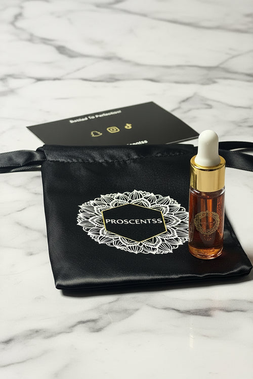 A 5ml oil bottle of Proscentss, featuring a oil bottle with a gold and white metallic cap and a gold-style graphic on the front.